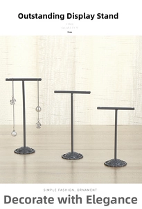 Three-piece metal T-bar jewelry stand set with floral relief bases for earring display