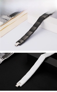 Detail of minimalist ceramic and titanium steel link bracelets with silver metal buckles