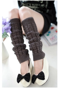 Detailed knit texture of dark coffee cable knit leg warmers for autumn and winter
