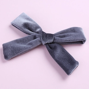 Close-up of a 5-inch dark grey velvet hair bow with a detailed fabric texture and alligator clip