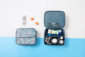 Internal compartments of blue flamingo pattern waterproof cosmetic storage bags