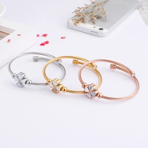 Minimalist shell clover bangles in silver, gold, and rose gold finishes for women