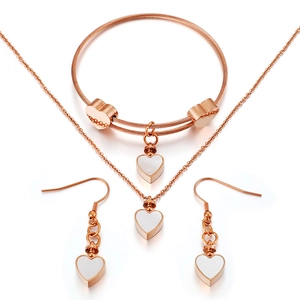 Elegant rose gold heart jewelry set featuring necklace bracelet and earrings on white background
