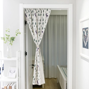 Nordic deer and pine tree printed off-white door curtain partition in a modern room