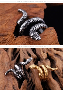 Detailed view of cobra snake rings with realistic scale textures in gold and silver finish