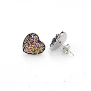 Macro shot of silver heart studs with purple druzy crystal inserts and butterfly backs