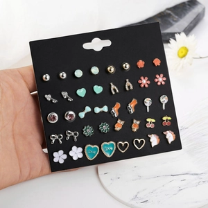Macro shot of 20 pairs colorful enamel stud earrings in candy shapes for young girls