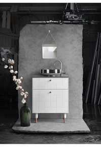Detail of a Nordic geometric bathroom set with white textured cabinet and gold metal accents