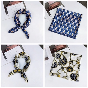 Detailed views of silk-like square scarves with geometric and leopard chain prints