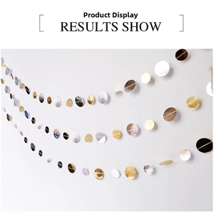 Detail of gold and silver metallic glitter round paper garland for birthday party decor