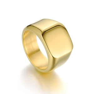 Close-up of a minimalist golden square signet ring with smooth polished steel finish
