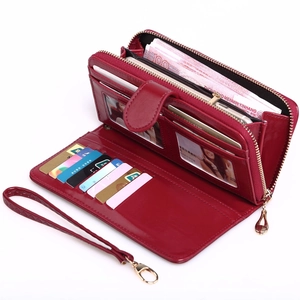 Women's burgundy faux leather long wallet with phone compartment and wrist strap