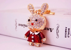 Macro shot of a gold-toned rabbit keychain with sparkling crystal rhinestones