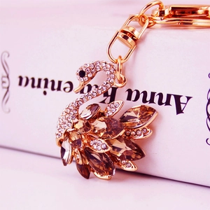 Elegant gold swan keychain with brown crystals and rhinestones for handbags and cars