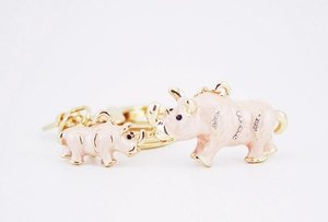 Detailed view of pink enamel mother and baby rhino keychain with shiny rhinestones