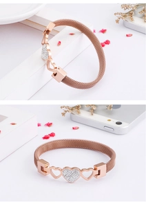 Detail view of rose gold mesh heart bracelet with sparkling zircon stones inlay