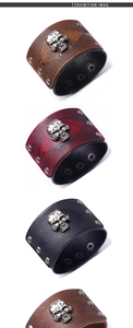 Close-up of punk leather bracelets featuring metal skull charms and rivet studs in multiple colors