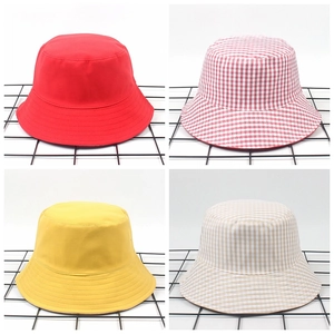 Collage of chic cotton bucket hats in solid red, yellow and plaid patterns for outdoors