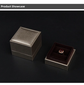 Macro view of champagne gold jewelry box with brushed texture and plush velvet interior