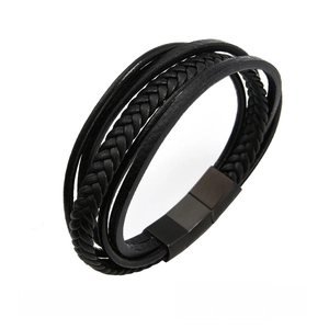 Close-up of black braided leather men's bracelet with magnetic matte metal clasp