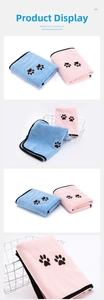Close-up of microfiber pet towel showing soft texture and cute paw print design