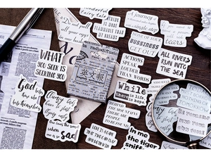 Macro view of vintage English newspaper style decorative stickers for DIY scrapbooking