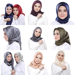 Detail showing various colors of smooth satin hijab fabric with elegant pearly luster