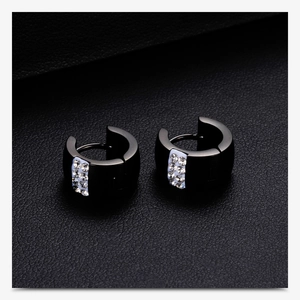 Detailed macro view of 7mm black stainless steel hoop earrings set with white crystals