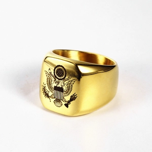 Macro detail of gold stainless steel signet ring with laser engraved US Great Seal emblem