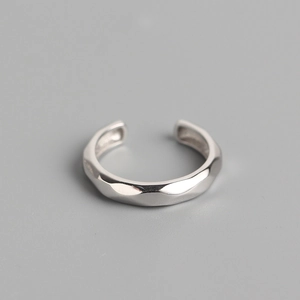 Minimalist S925 sterling silver open ring with geometric faceted surface on grey background
