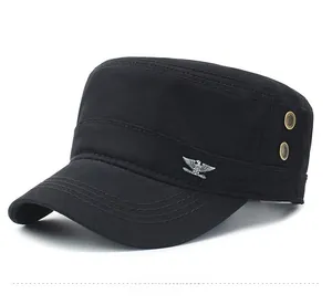 Detail view of black cotton cadet cap with metal eagle badge and side ventilation eyelets