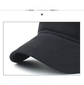 Detailed close-up of a black cotton baseball cap brim with durable reinforced stitching