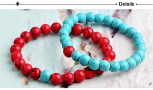 Macro shot of 8mm red and turquoise stone bracelets with natural black marble veins