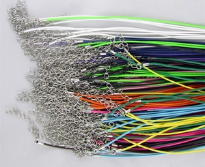 Close-up of colorful waxed cord necklaces with metal lobster clasps and extension chains