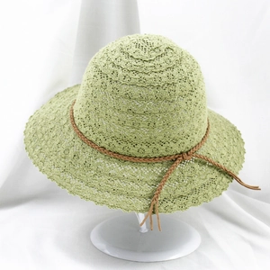Women's light green lace hollow straw hat with bow for sun protection and beach vacation