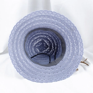 Detail view of light purple lace sun hat interior with adjustable strap and sweatband