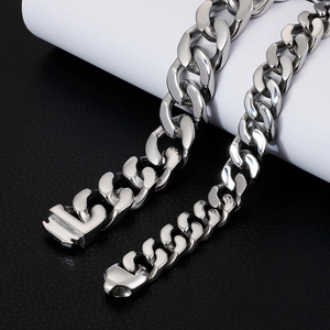 Silver polished titanium steel Cuban link bracelet for men on black leather background