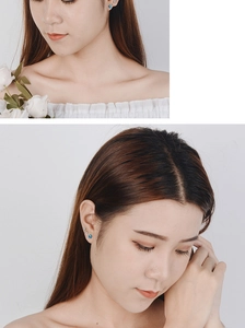 Detailed close-up of blue star crystal stud earrings worn by a model in soft lighting