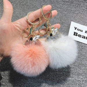 Portachiavi maialino volante in peluche rosa e bianco con strass e anelli dorati