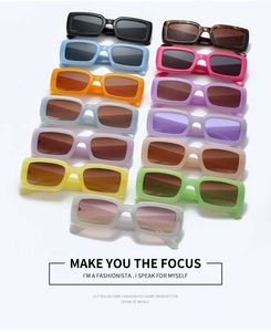 Flat lay of square-frame sunglasses in various candy colors and fashion styles