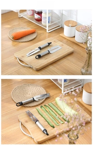 Dual stainless steel peelers with ergonomic handles shown slicing fresh cucumbers