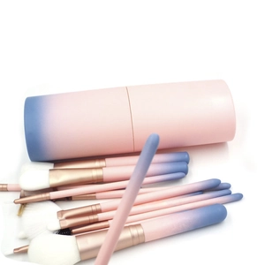 Gradient pink and blue 12-piece makeup brush set with rose gold metal tube and storage cylinder