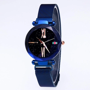 Detail of blue starry dial watch with magnetic mesh strap and diamond-cut case