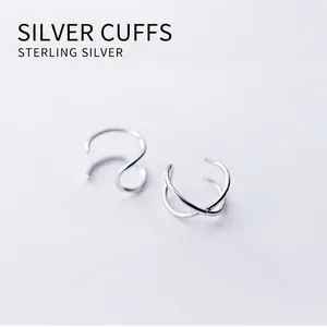Minimalist double layer S925 silver ear cuff featuring modern X-cross and spiral designs