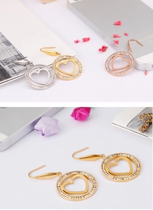 Lot de boucles d'oreilles cœur évidé avec strass en finitions or, argent et or rose