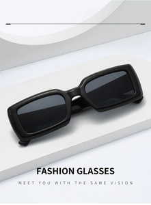 Close-up of black rectangular sunglasses with thick frames on minimalist geometric stands