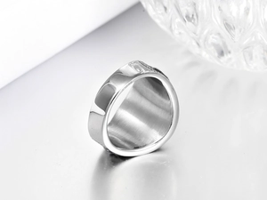 Macro view of silver star steel ring showing polished edges and inner brushed texture
