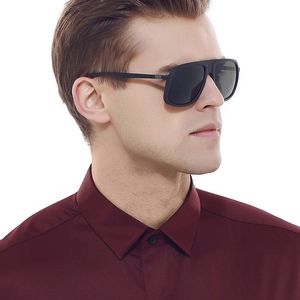Side view of men's black square polarized sunglasses worn by model in red shirt