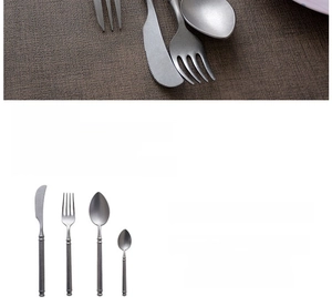Macro view of matte stainless steel cutlery set with frosted snowflake sand finish