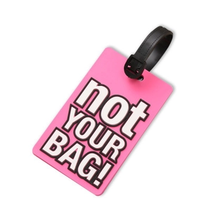 Pink PVC luggage tag with 'not YOUR BAG!' text and black strap on white background
